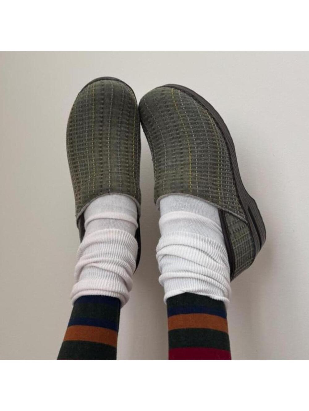 Dansko green striped platform clogs.